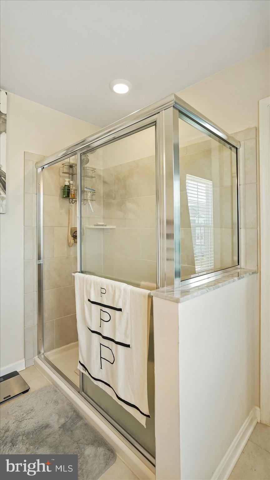 5085 Silver Oak Drive Rosedale, MD 21237 - Photo 35 of 48 a bathroom with a shower and a mirror