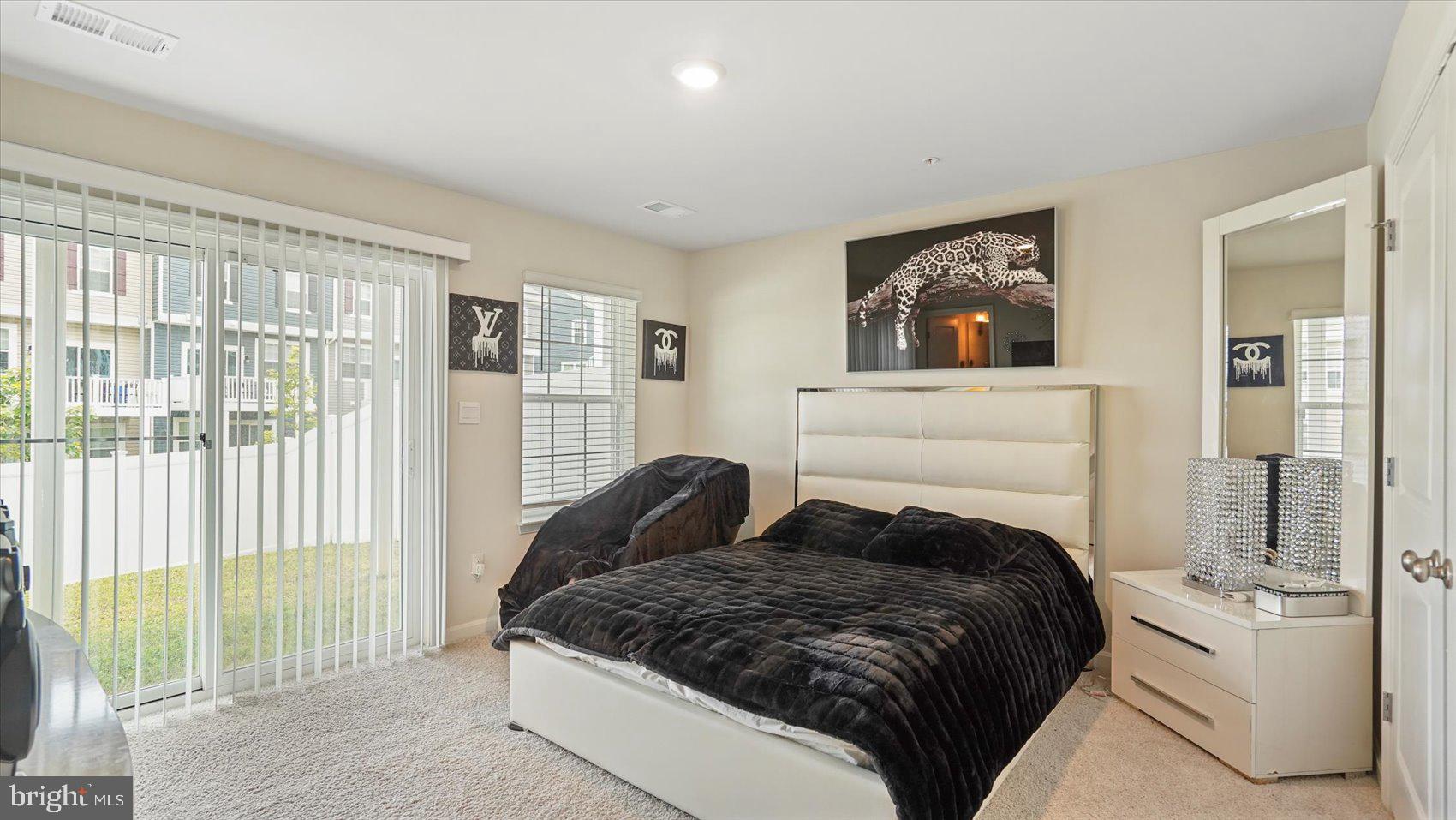 5085 Silver Oak Drive Rosedale, MD 21237 - Photo 5 of 48 a bedroom with a bed and a large window