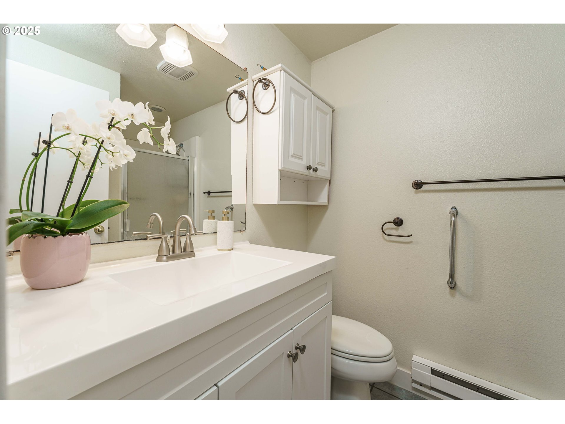 71682 Neer City Road Rainier, OR 97048 - Photo 18 of 48 a bathroom with a sink a mirror and a toilet