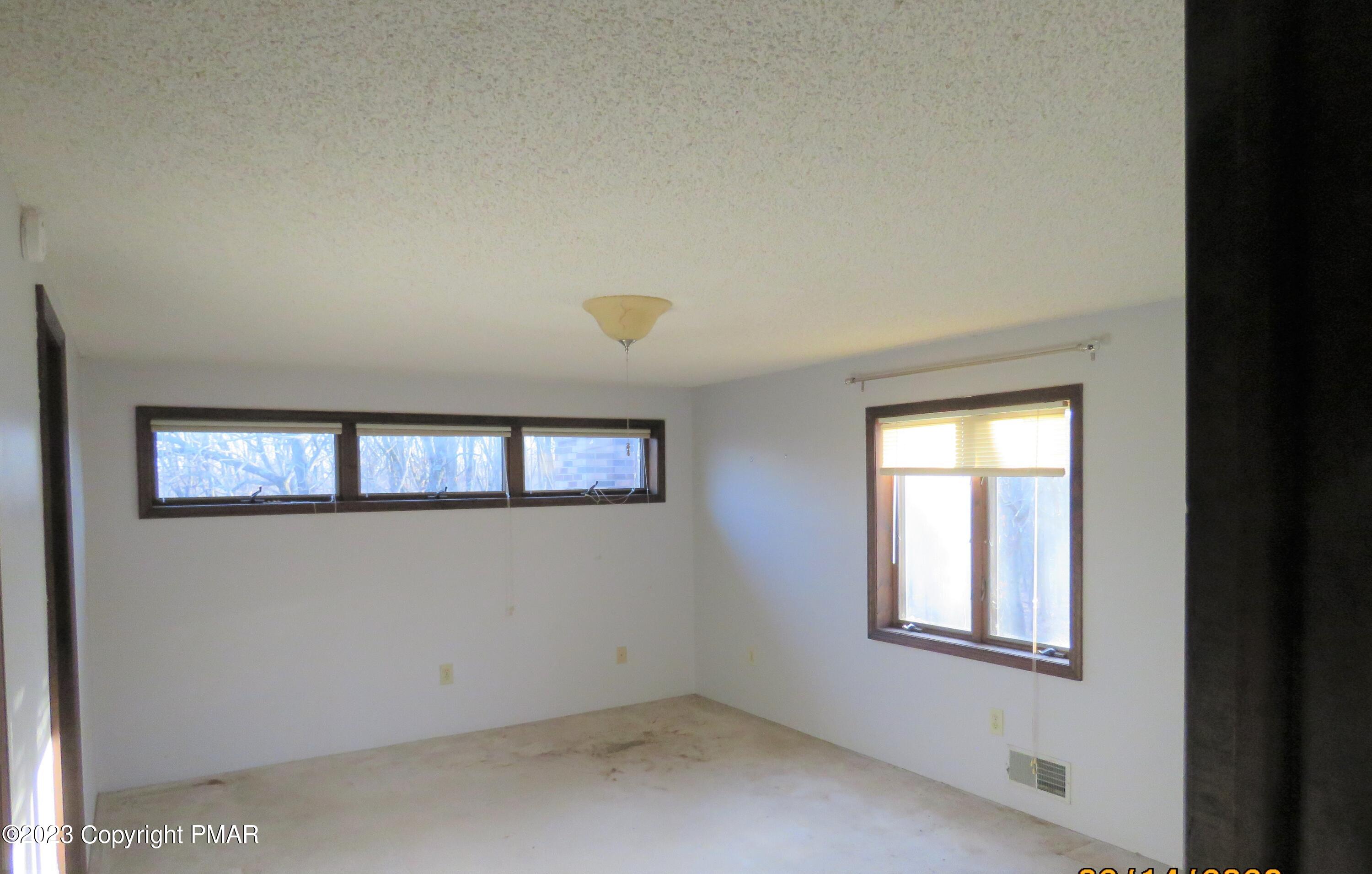 2653 Mountain Road Slatington, PA 18080 - Photo 9 of 19 an empty room with windows