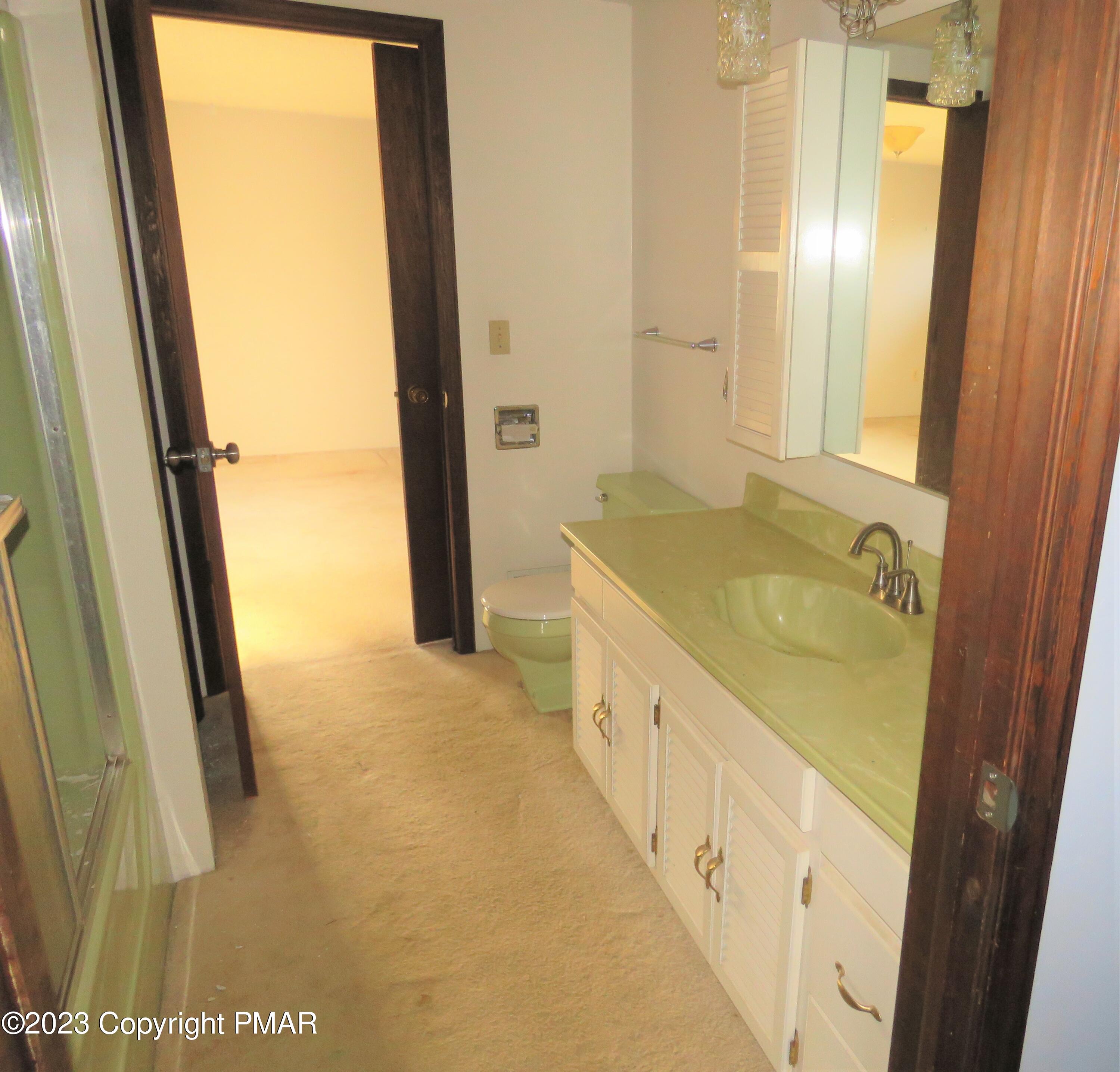 2653 Mountain Road Slatington, PA 18080 - Photo 10 of 19 a bathroom with a granite countertop sink and a large mirror