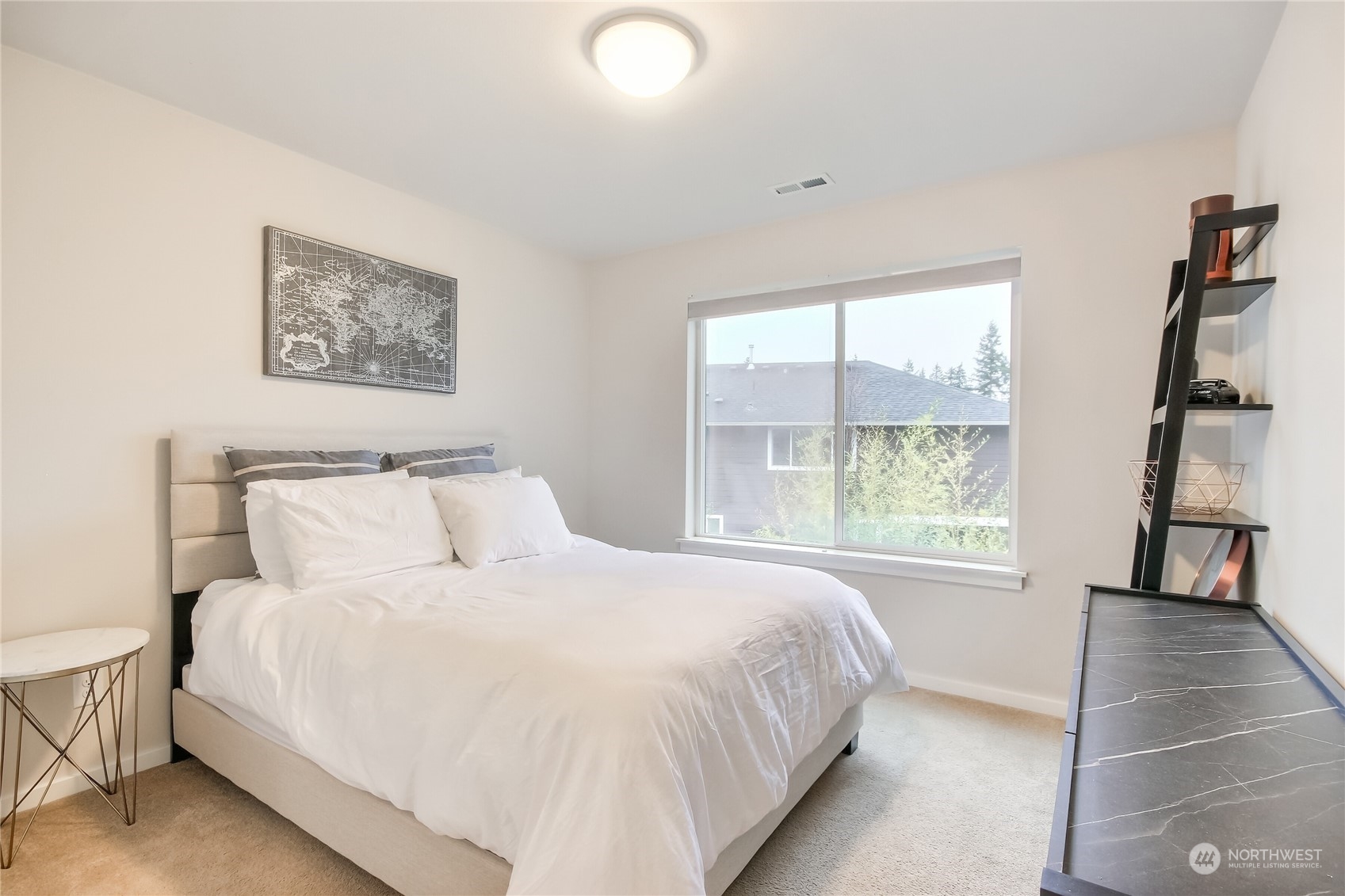3822 Northeast 24th Court Renton, WA 98056 - Photo 21 of 37 a bedroom with a bed and a window