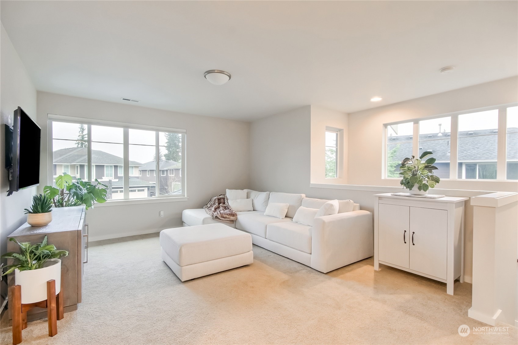3822 Northeast 24th Court Renton, WA 98056 - Photo 24 of 37 a living room with furniture and windows