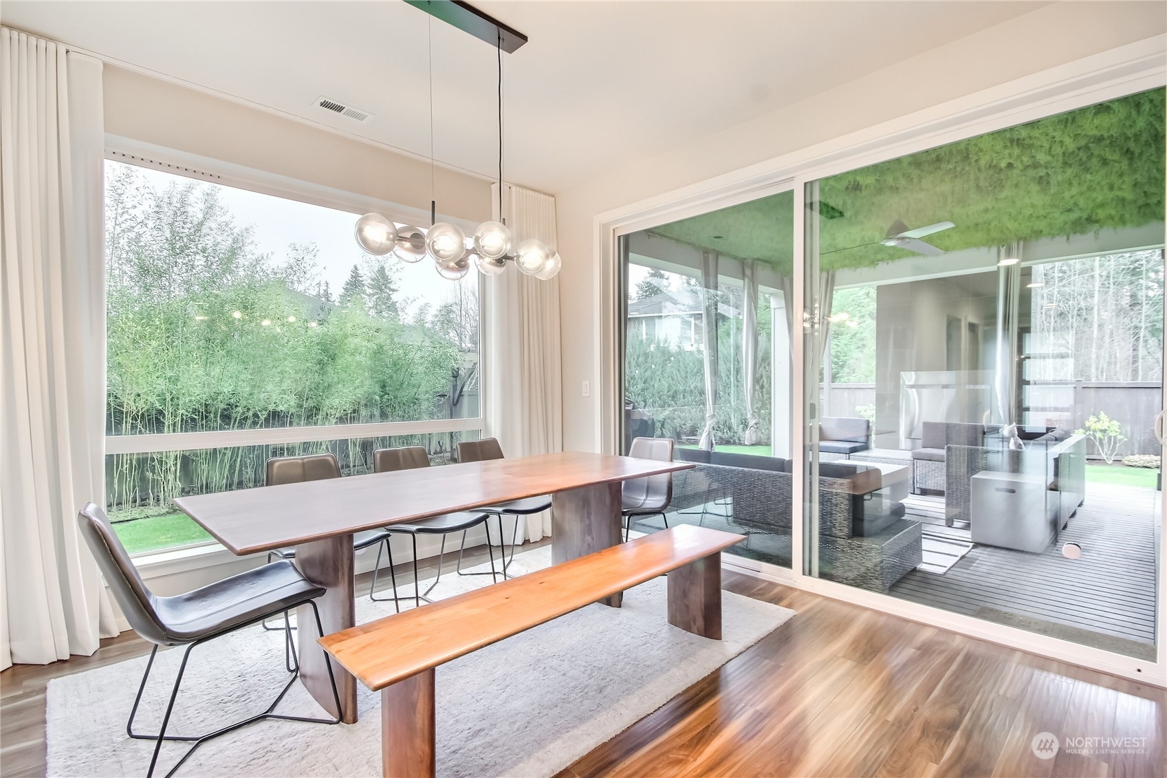 3822 Northeast 24th Court Renton, WA 98056 - Photo 7 of 37 a dining room with furniture a chandelier and wooden floor