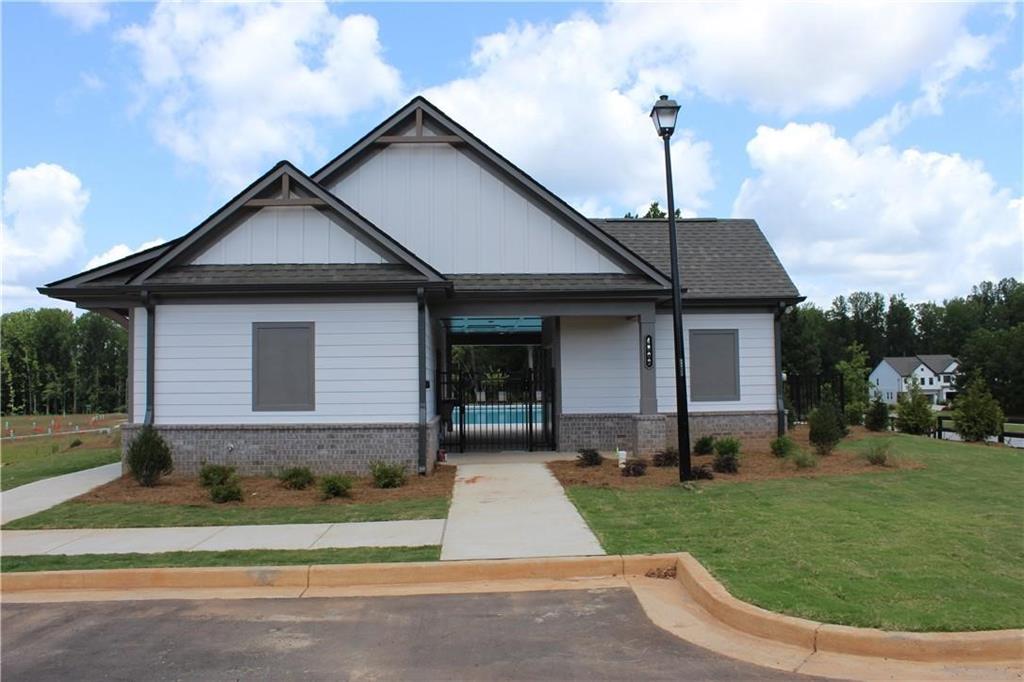 5299 Magnolia Grove Way, Unit 182 Gainesville, GA 30504 - Photo 18 of 79 a front view of a house with a yard