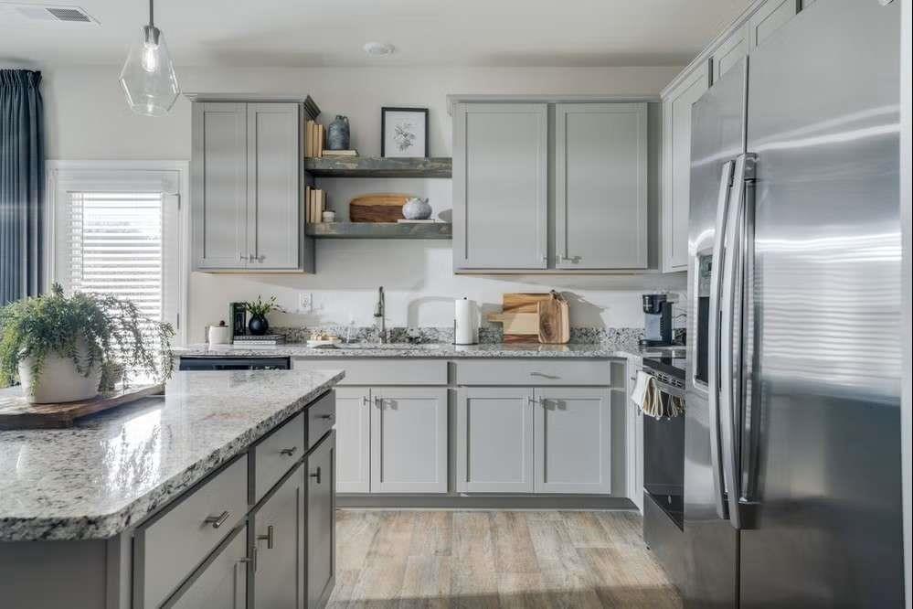 5299 Magnolia Grove Way, Unit 182 Gainesville, GA 30504 - Photo 36 of 79 a kitchen with stainless steel appliances granite countertop a sink stove and refrigerator