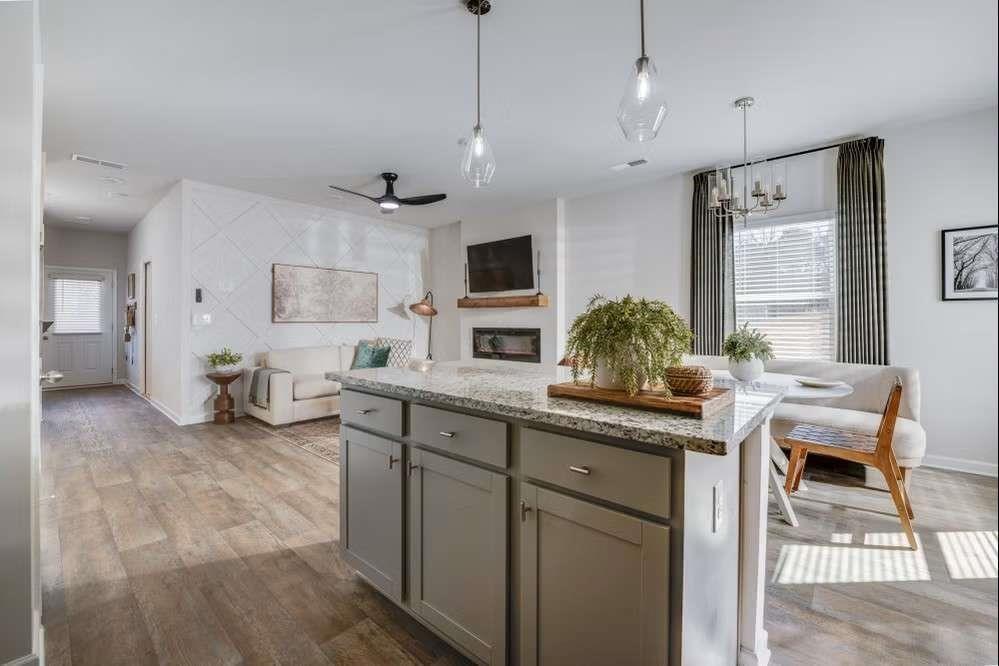 5299 Magnolia Grove Way, Unit 182 Gainesville, GA 30504 - Photo 37 of 79 a kitchen with stainless steel appliances kitchen island granite countertop a sink and cabinets
