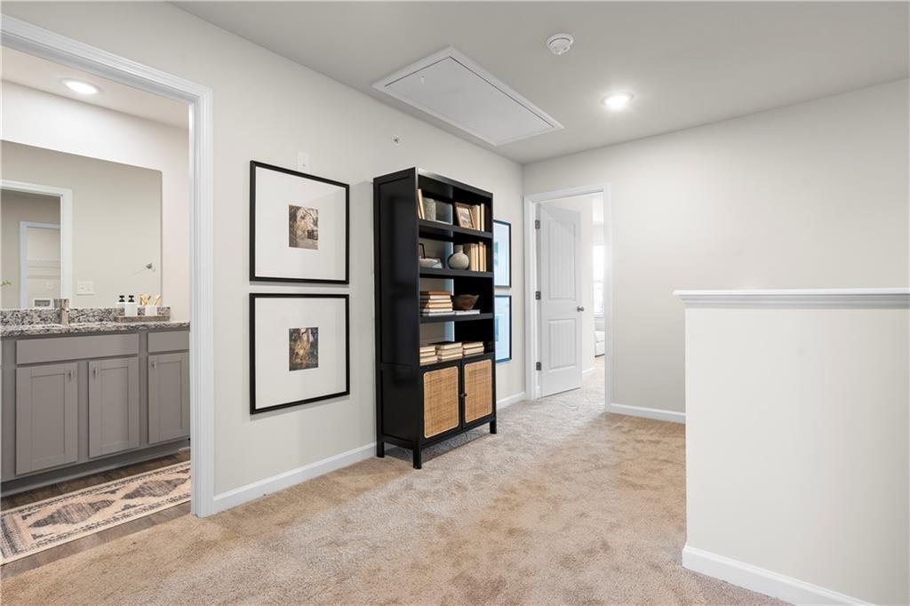 5299 Magnolia Grove Way, Unit 182 Gainesville, GA 30504 - Photo 49 of 79 a view of kitchen with refrigerator and white cabinets