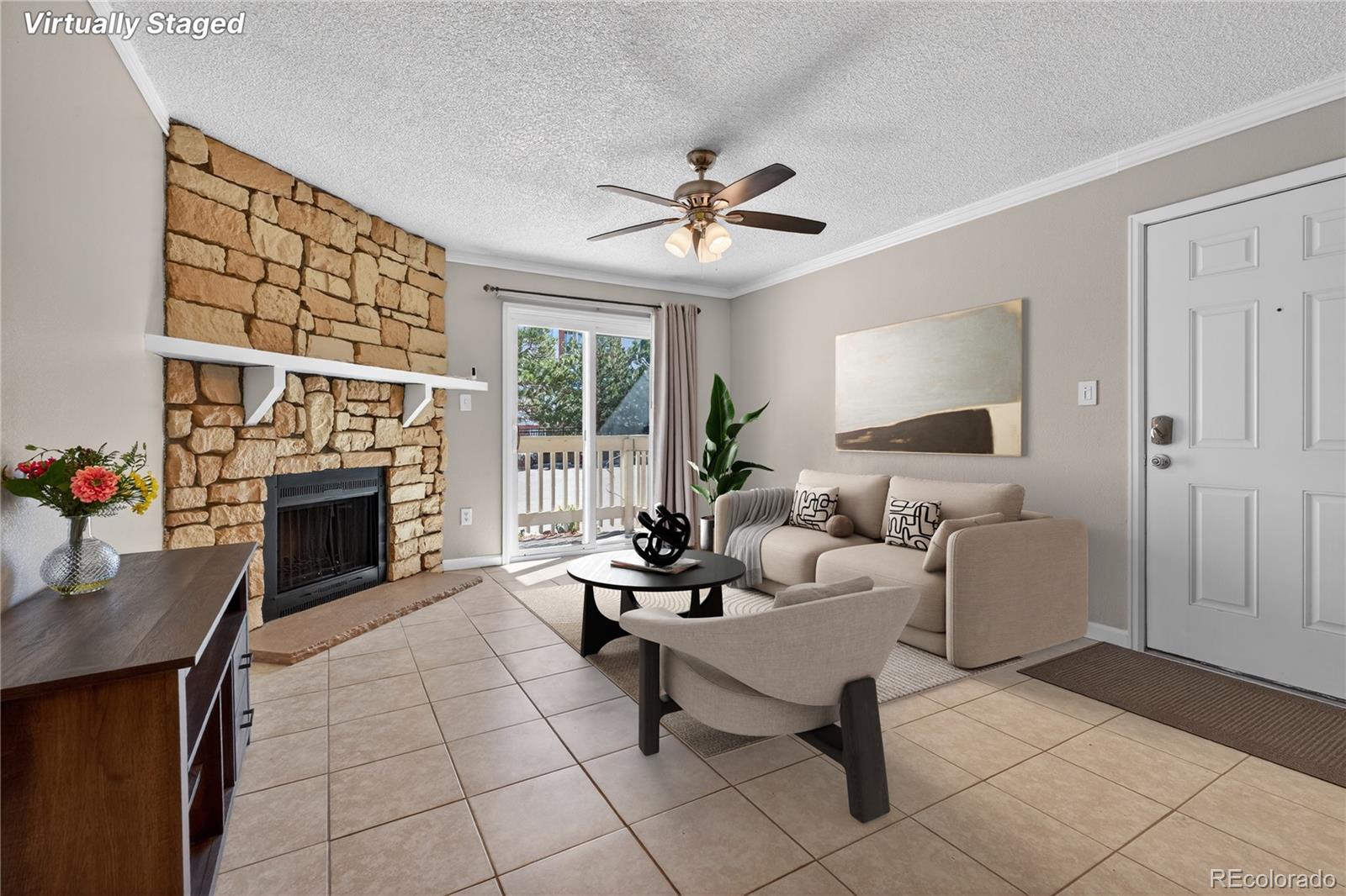 a living room with furniture a fireplace and a table