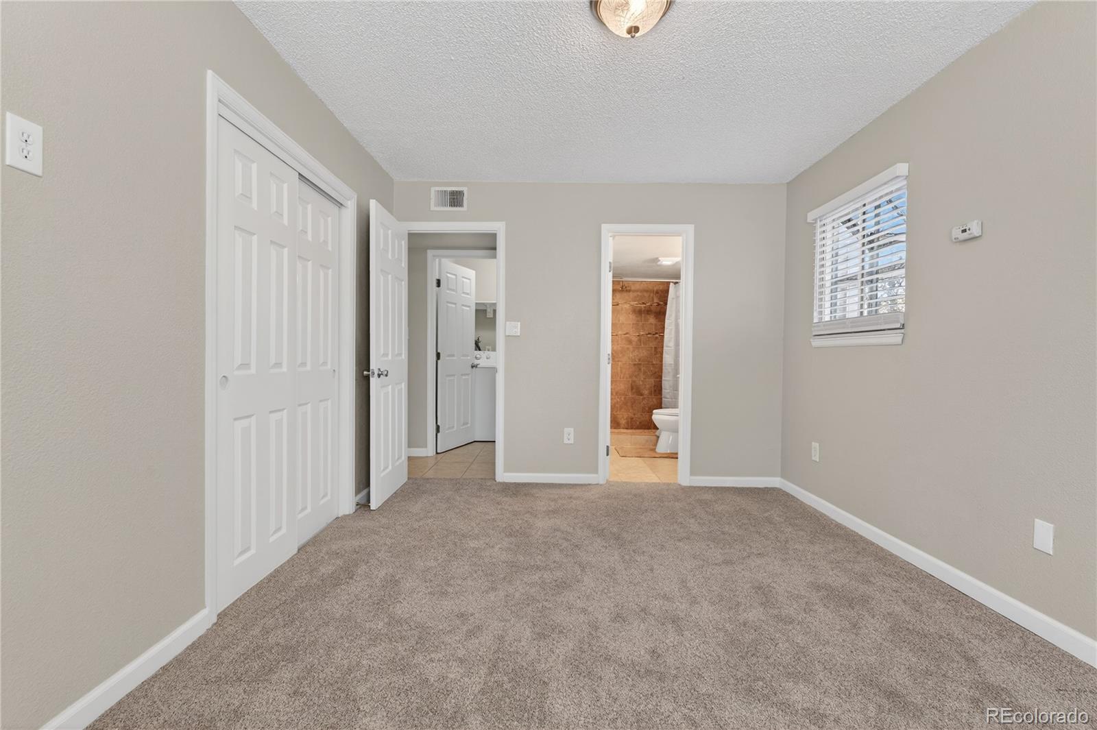 4400 South Quebec Street, Unit 101P Denver, CO 80237 - Photo 12 of 26 an empty room with windows