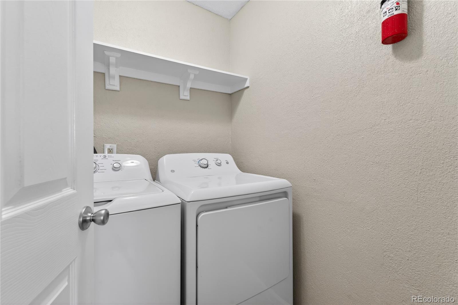 4400 South Quebec Street, Unit 101P Denver, CO 80237 - Photo 14 of 26 a utility room with dryer and washer