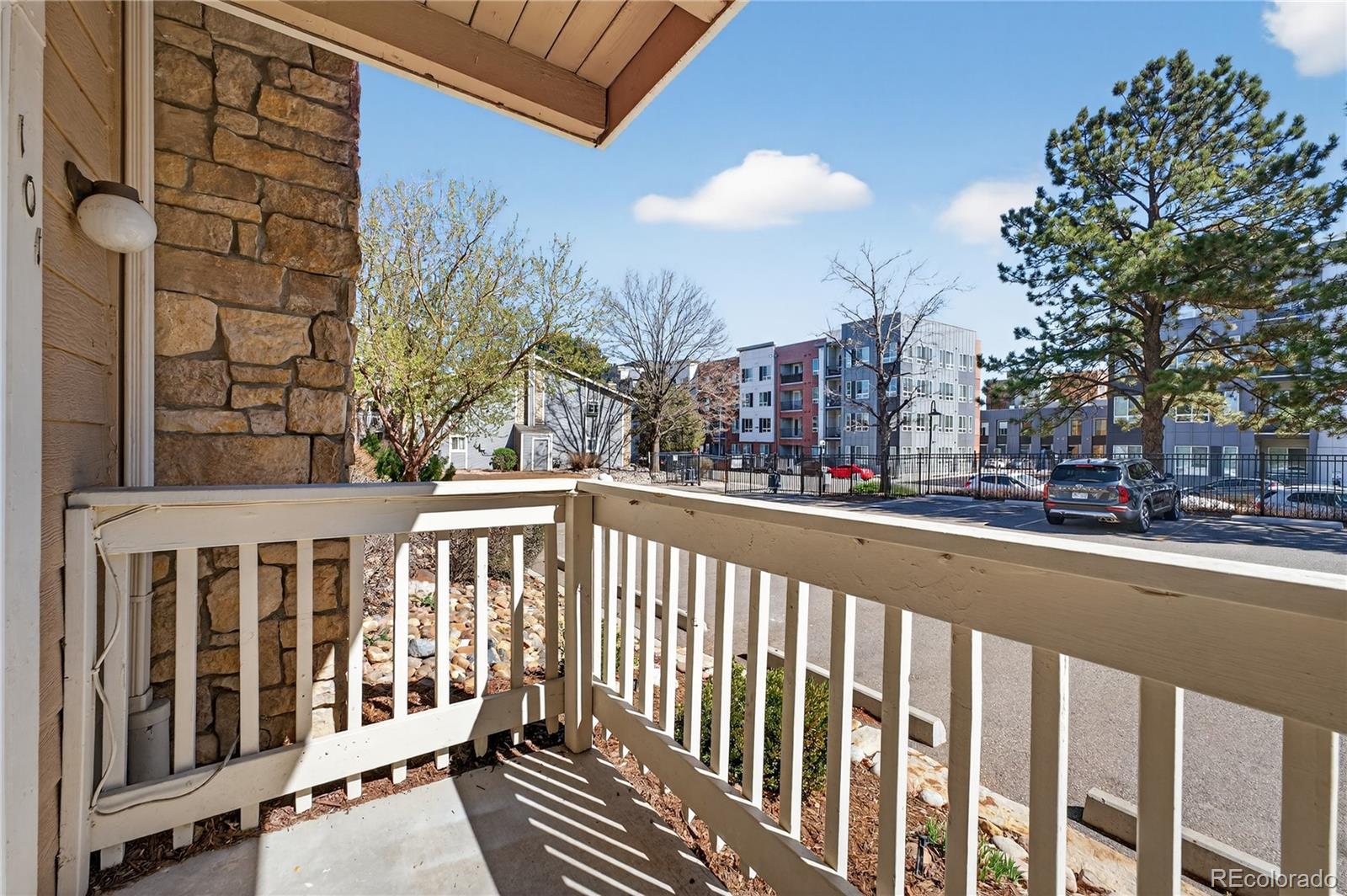 4400 South Quebec Street, Unit 101P Denver, CO 80237 - Photo 19 of 26 a view of a brick building from a balcony