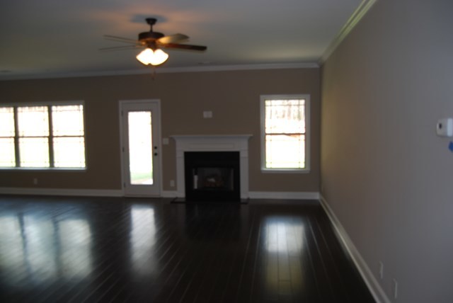 185 Presidents Way Forsyth, GA 31029 - Photo 3 of 18 a view of an empty room with wooden floor and a window