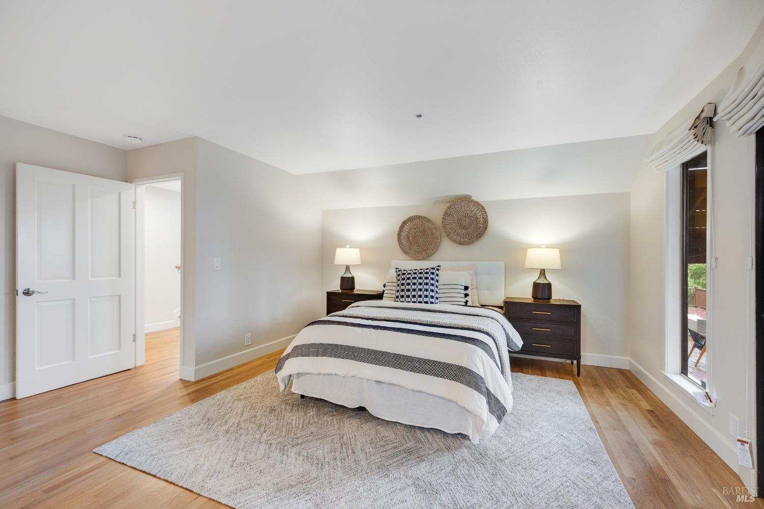 101 Garner Drive Novato, CA 94947 - Photo 12 of 34 a bedroom with a bed and wooden floor