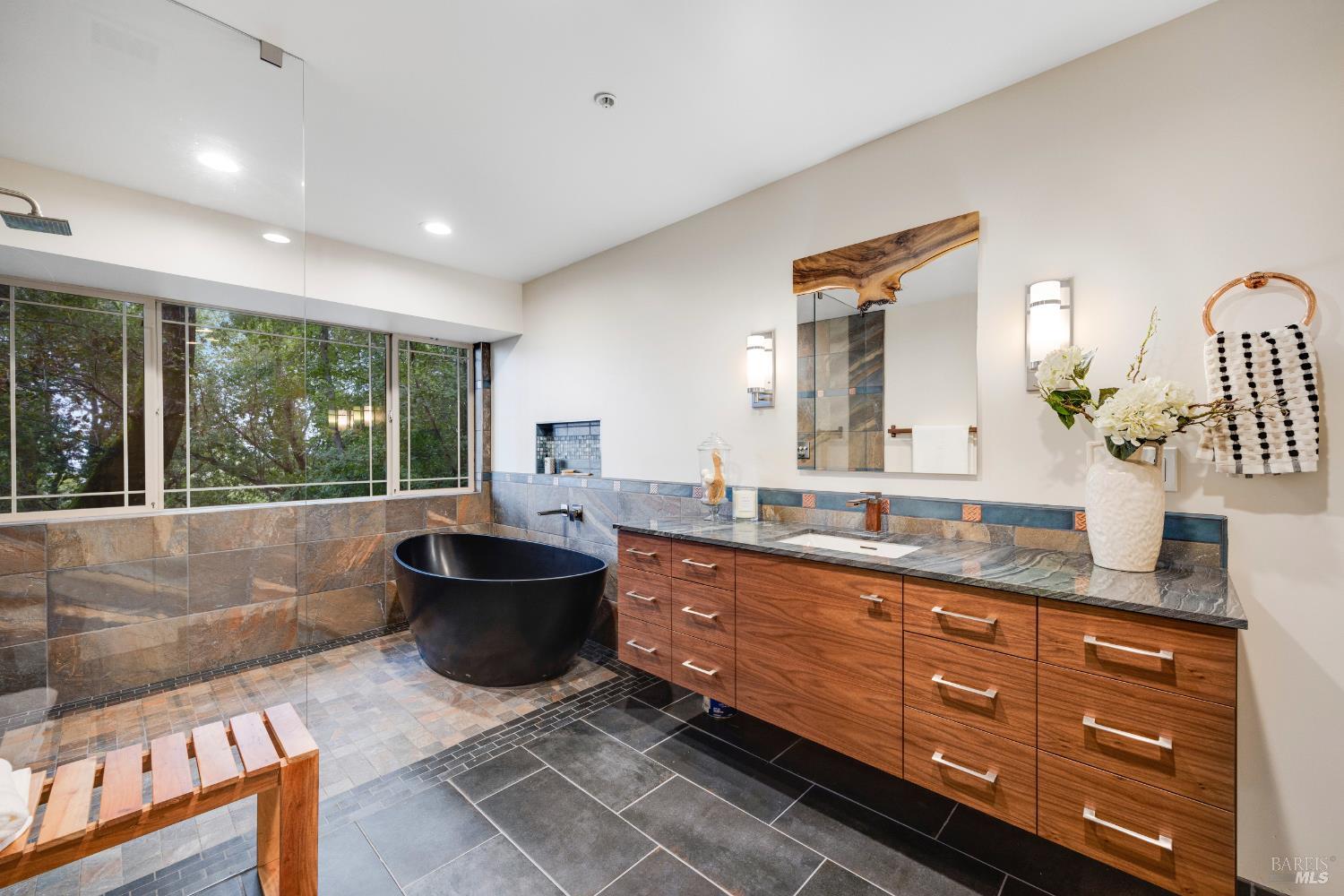 101 Garner Drive Novato, CA 94947 - Photo 13 of 34 a bathroom with a granite countertop toilet sink and mirror