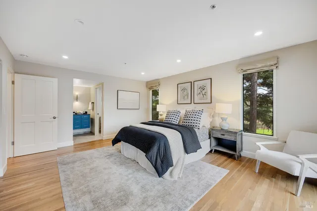 a bedroom with a large bed and a couch