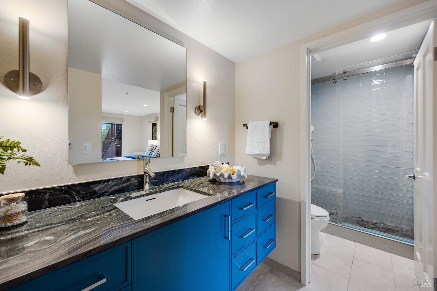 101 Garner Drive Novato, CA 94947 - Photo 20 of 34 a bathroom with a granite countertop sink mirror and double