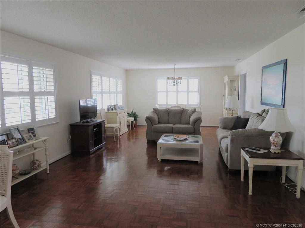 1843 Southeast Granada Lane Stuart, FL 34996 - Photo 11 of 31 a living room with furniture wooden floor and a window