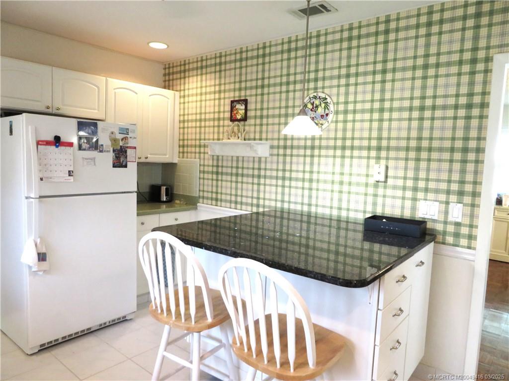 1843 Southeast Granada Lane Stuart, FL 34996 - Photo 17 of 31 a bathroom with a sink and a shower