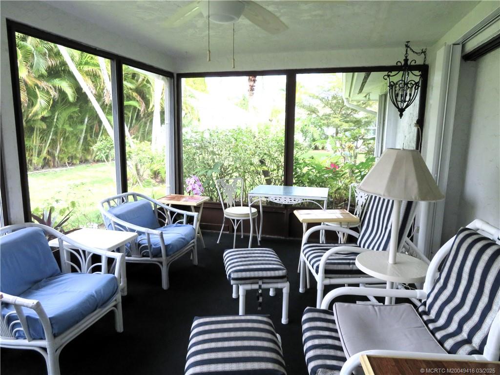 1843 Southeast Granada Lane Stuart, FL 34996 - Photo 6 of 31 a outdoor living room with furniture and a large window