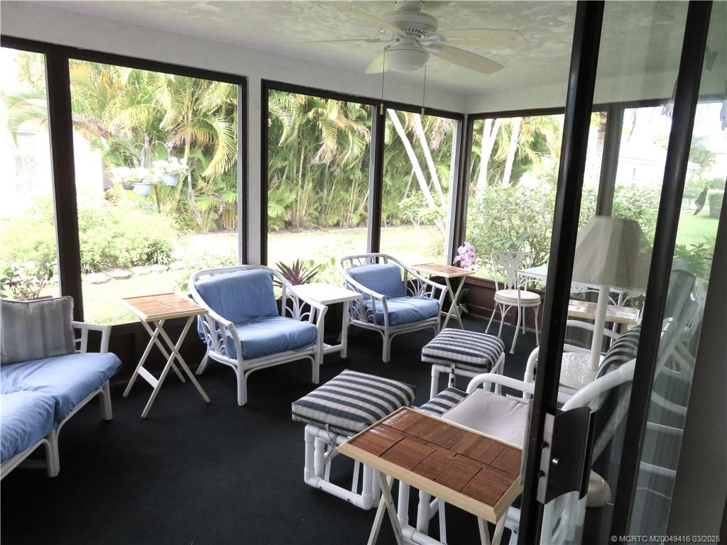 1843 Southeast Granada Lane Stuart, FL 34996 - Photo 7 of 31 a living room with furniture and large windows