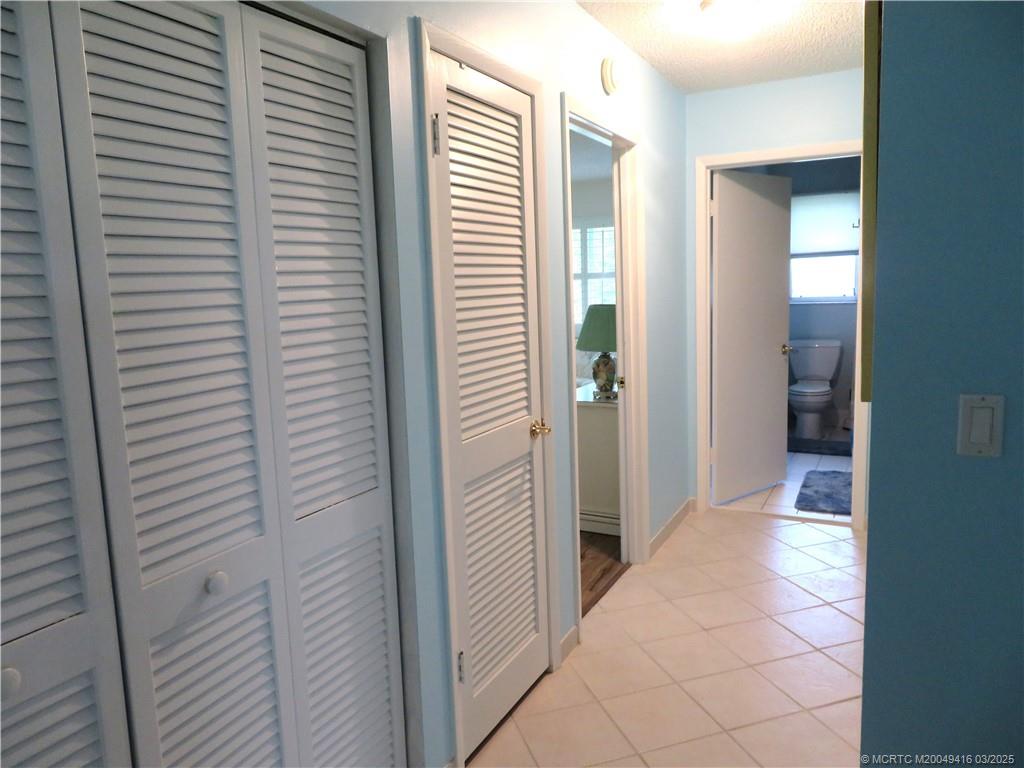1843 Southeast Granada Lane Stuart, FL 34996 - Photo 10 of 31 a view of a hallway with a window