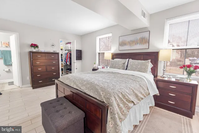 a bedroom with a bed and a dresser