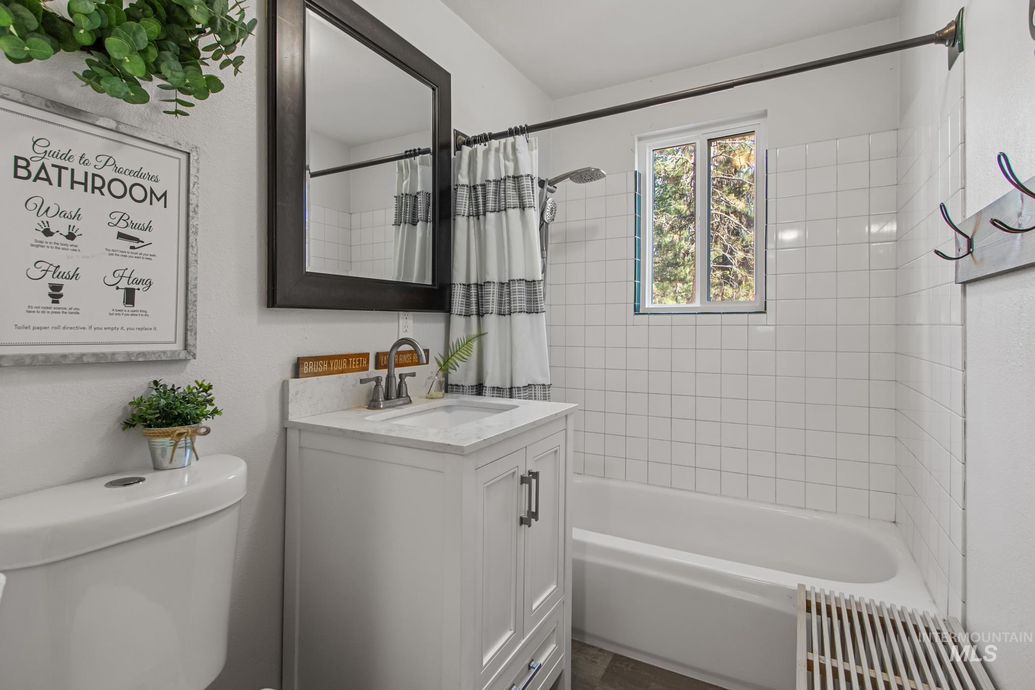 12 Meadow Creek Road Idaho City, ID 83631 - Photo 23 of 44 Full bathroom featuring shower / bathtub combination with curtain and vanity