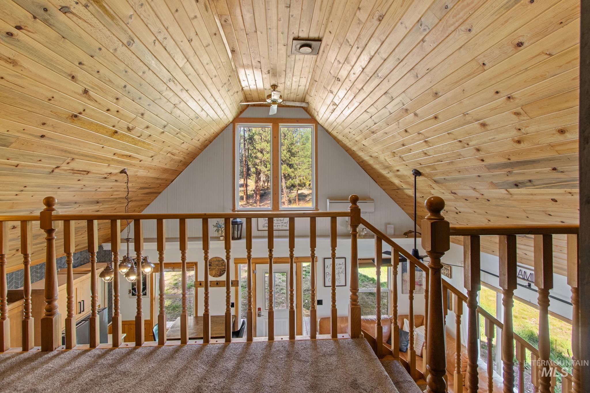 12 Meadow Creek Road Idaho City, ID 83631 - Photo 27 of 44 Bonus room featuring wood ceiling, ceiling fan, carpet floors, and vaulted ceiling