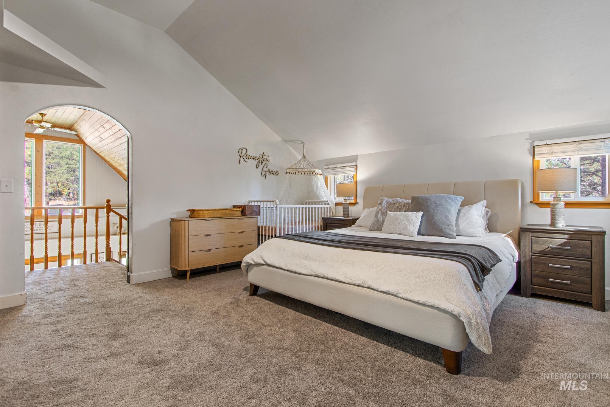 12 Meadow Creek Road Idaho City, ID 83631 - Photo 31 of 44 Carpeted bedroom with multiple windows and lofted ceiling