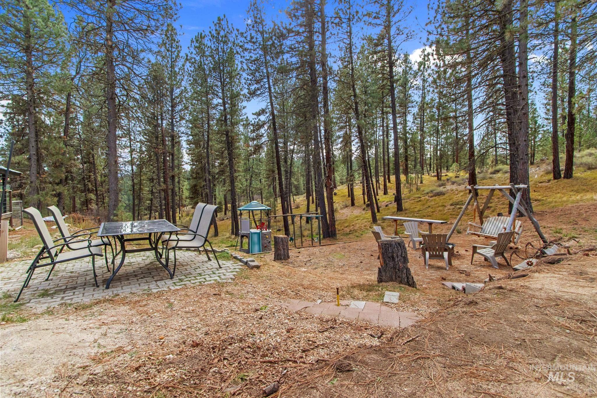 12 Meadow Creek Road Idaho City, ID 83631 - Photo 37 of 44 View of yard featuring a patio and a playground