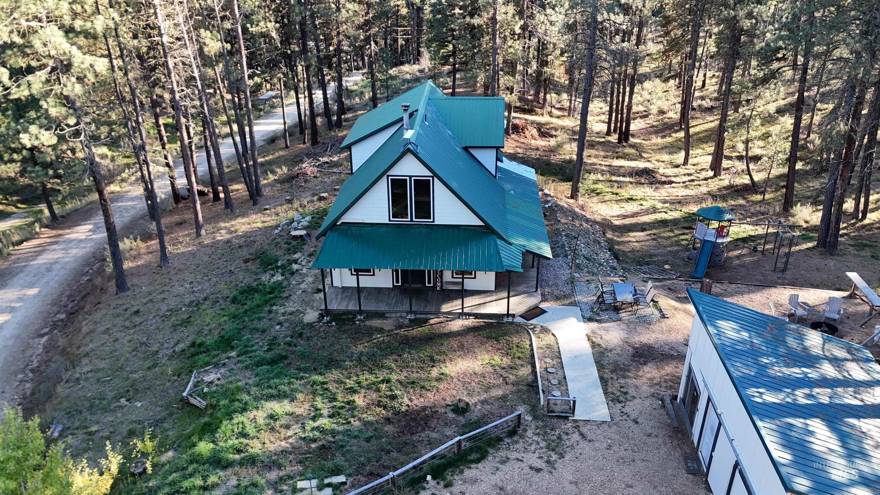 12 Meadow Creek Road Idaho City, ID 83631 - Photo 42 of 44 View of front of house featuring a metal roof and a porch