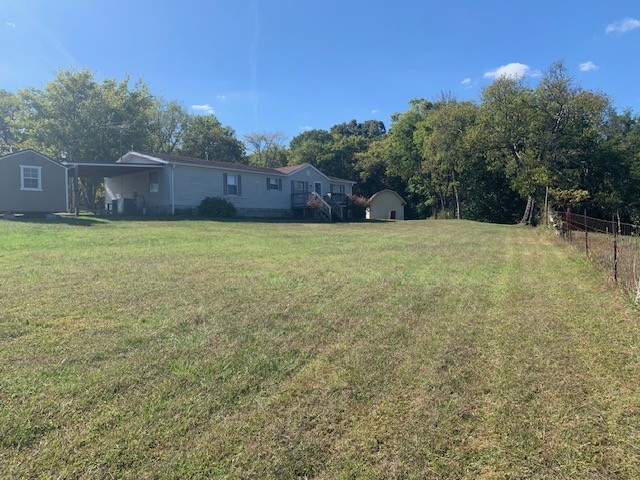 890 Bell Road Watertown, TN 37184 - Photo 3 of 62 a backyard of a house with lots of green space