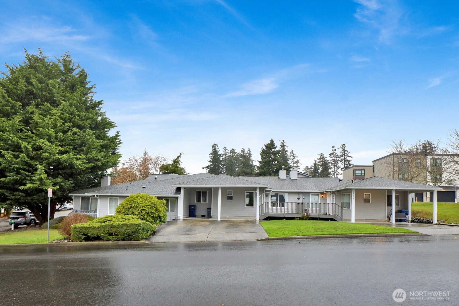 1502 Burrows Court Anacortes, WA 98221 - Photo 1 of 15 a front view of a house with a garden