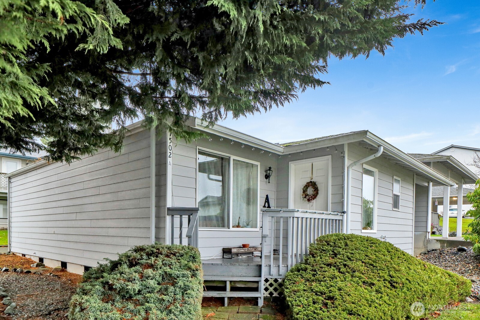 1502 Burrows Court Anacortes, WA 98221 - Photo 2 of 15 a front view of a house with garden