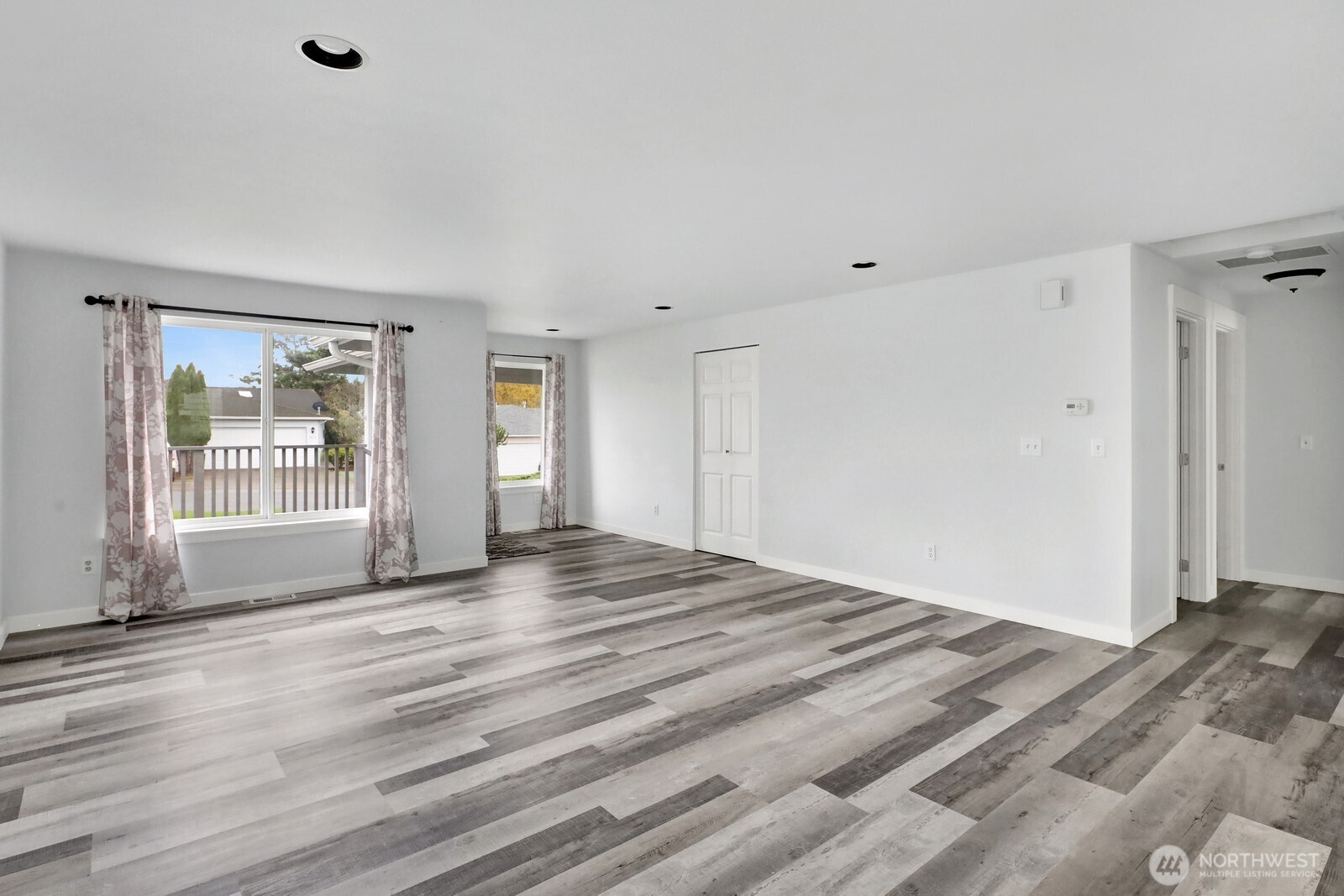 1502 Burrows Court Anacortes, WA 98221 - Photo 4 of 15 a view of empty room with wooden floor and fan