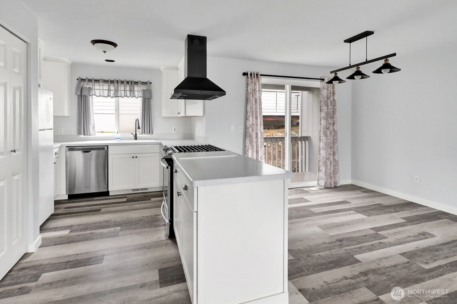 1502 Burrows Court Anacortes, WA 98221 - Photo 6 of 15 a kitchen with stainless steel appliances granite countertop a sink stove and refrigerator