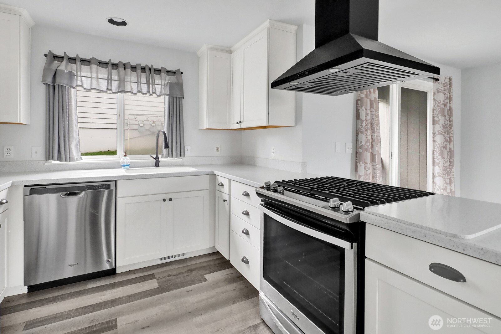 1502 Burrows Court Anacortes, WA 98221 - Photo 8 of 15 a kitchen with stainless steel appliances a white stove top oven and sink
