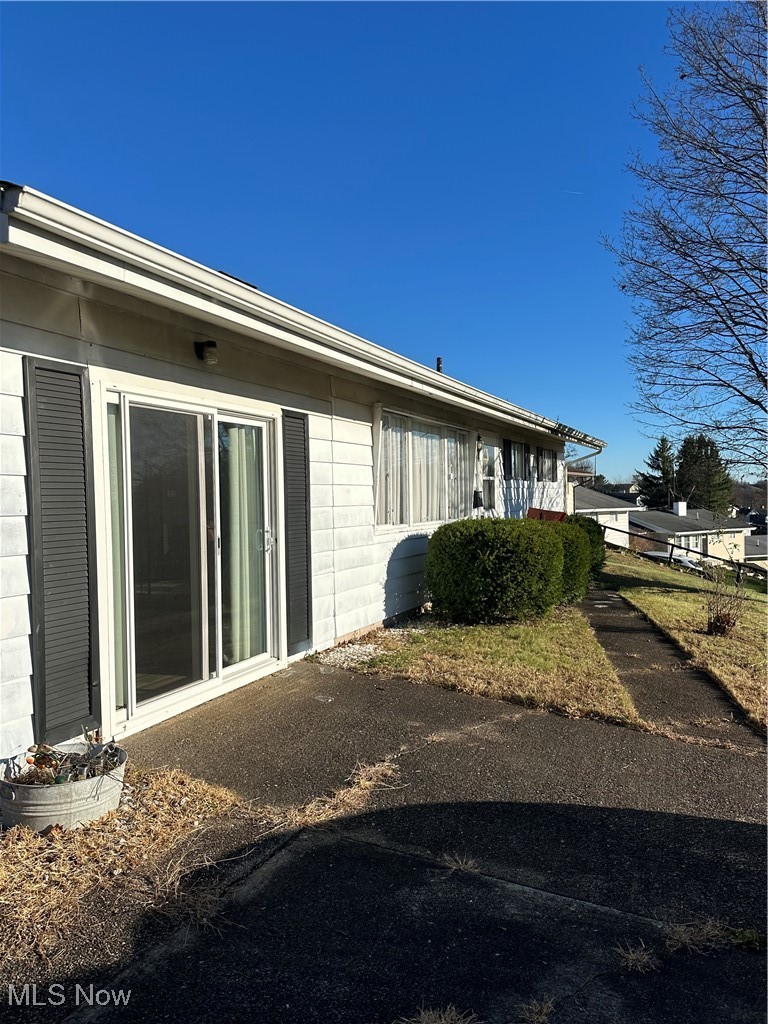 314 Devon Road Woodsfield, OH 43793 - Photo 3 of 50 Front with sliding door entry, sidewalk and paved parking
