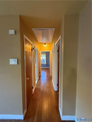 a view of gallery with wooden floor