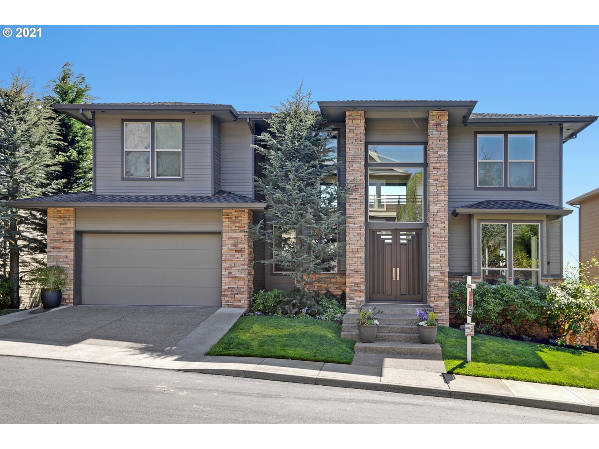 3959 Northwest Sunset Circle Portland, OR 97229 - Photo 1 of 1 a front view of a house with garden