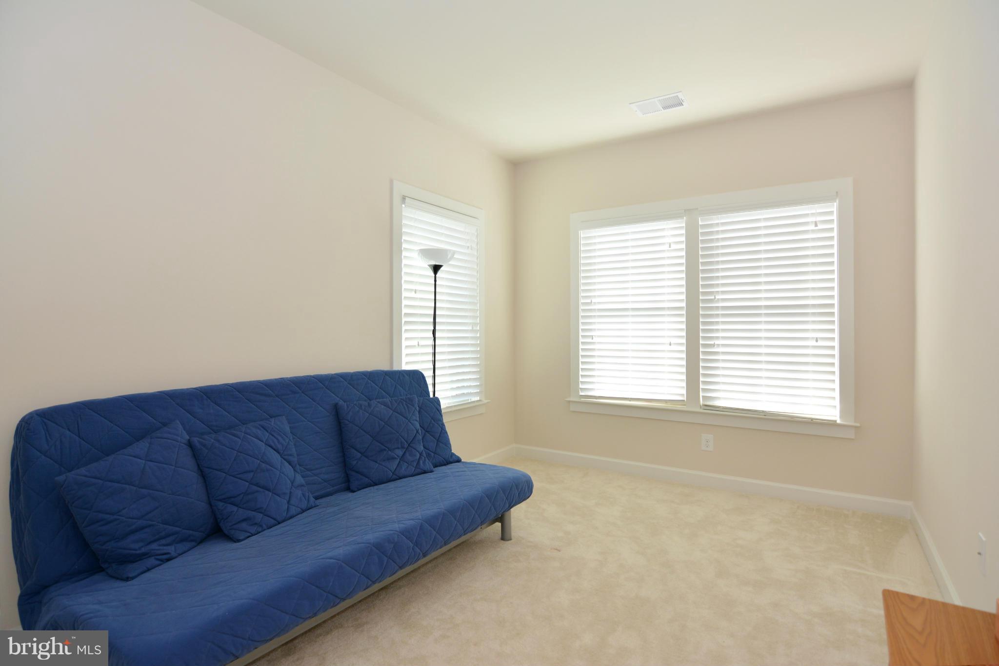 7403 Matapan Drive Hanover, MD 21076 - Photo 14 of 37 Bright and comfortable guest room