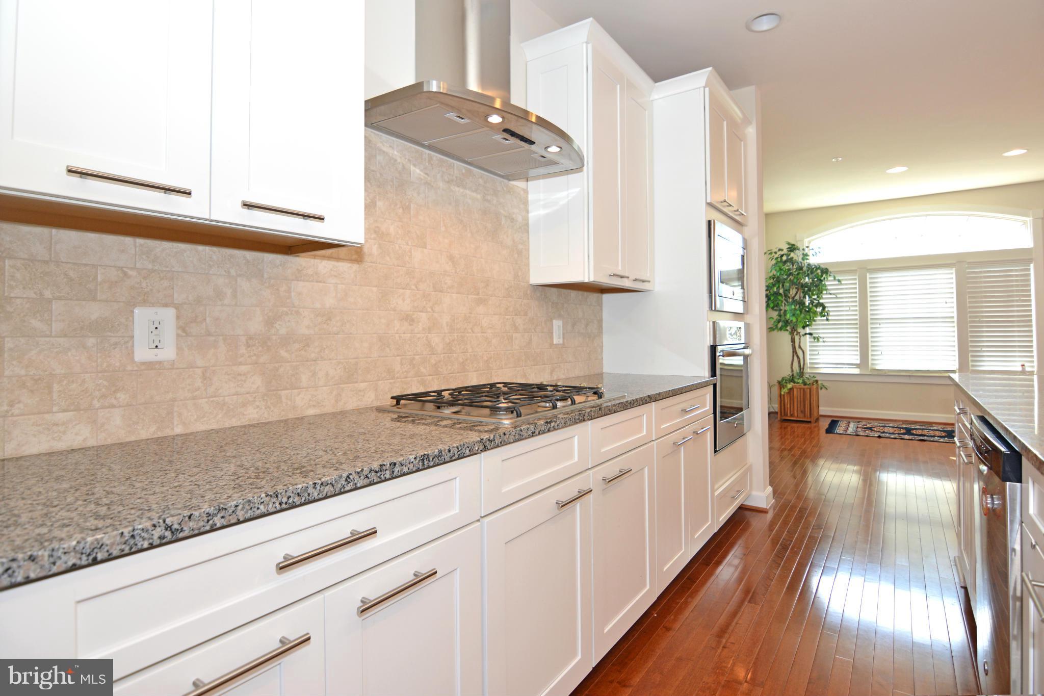 7403 Matapan Drive Hanover, MD 21076 - Photo 17 of 37 Kitchen has natural light from both sides