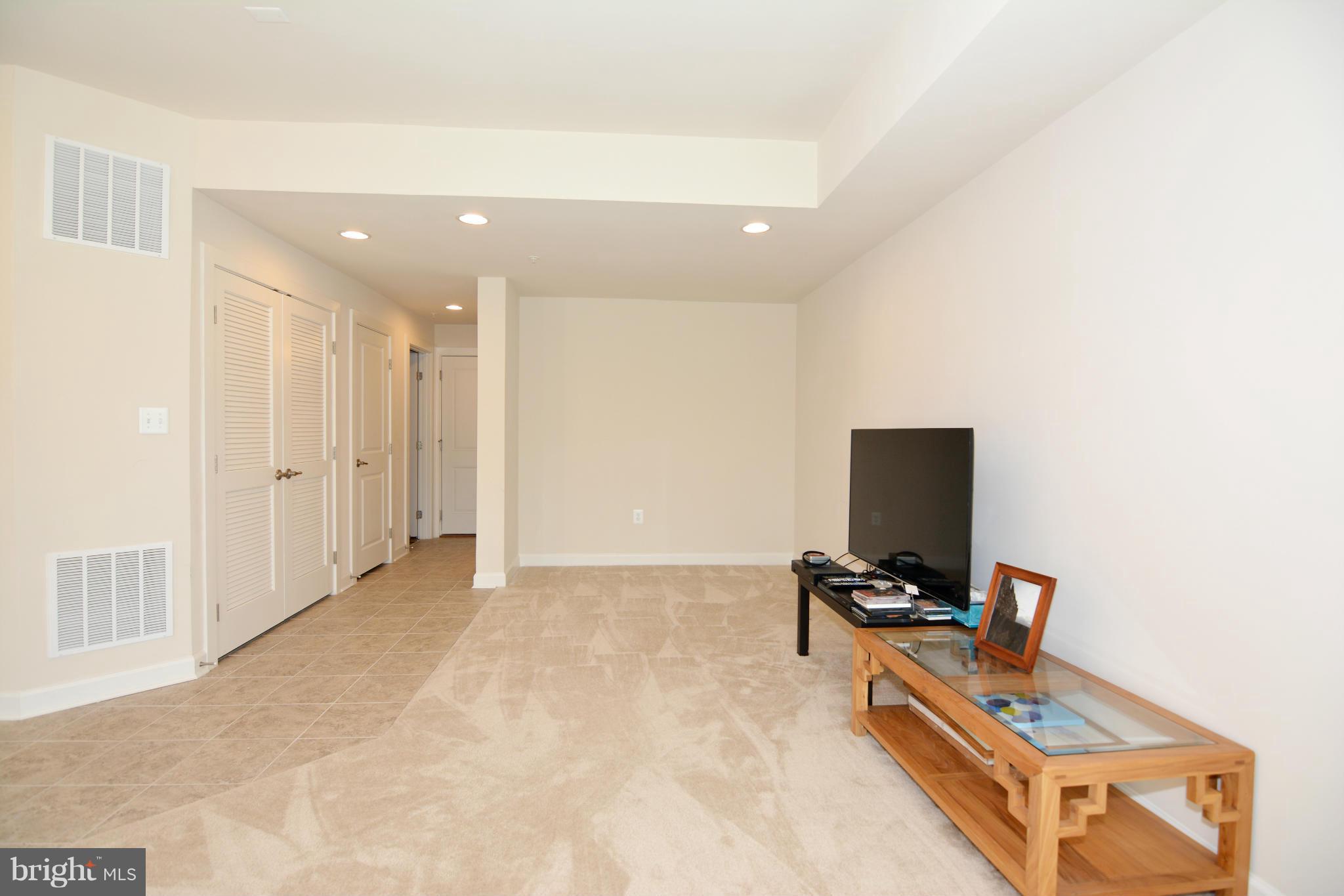 7403 Matapan Drive Hanover, MD 21076 - Photo 19 of 37 Rec room with full bath and garage access