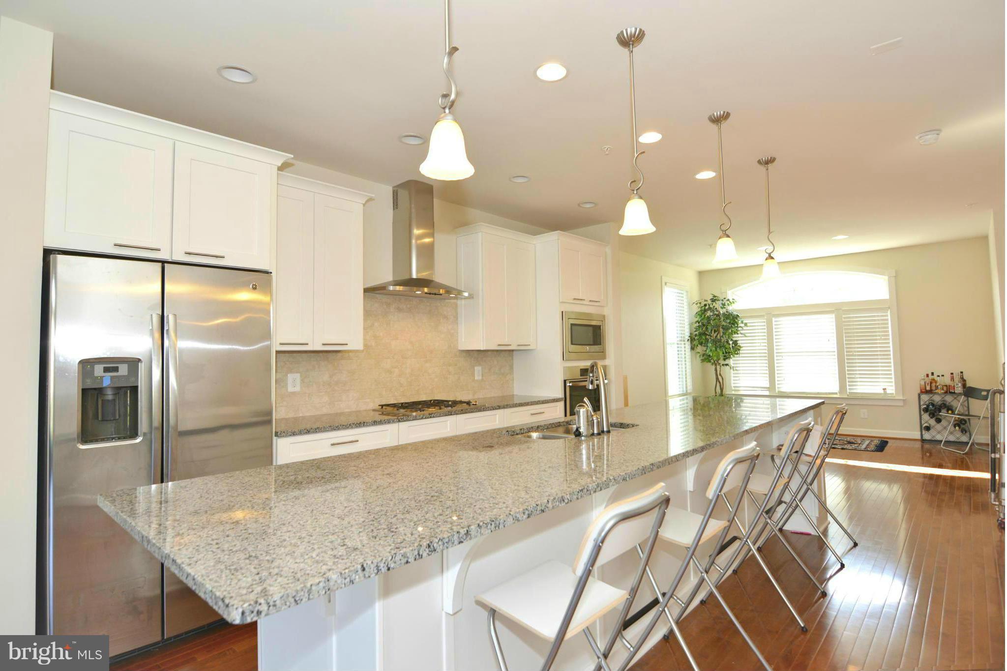 7403 Matapan Drive Hanover, MD 21076 - Photo 4 of 37 Kitchen flows to dining space.