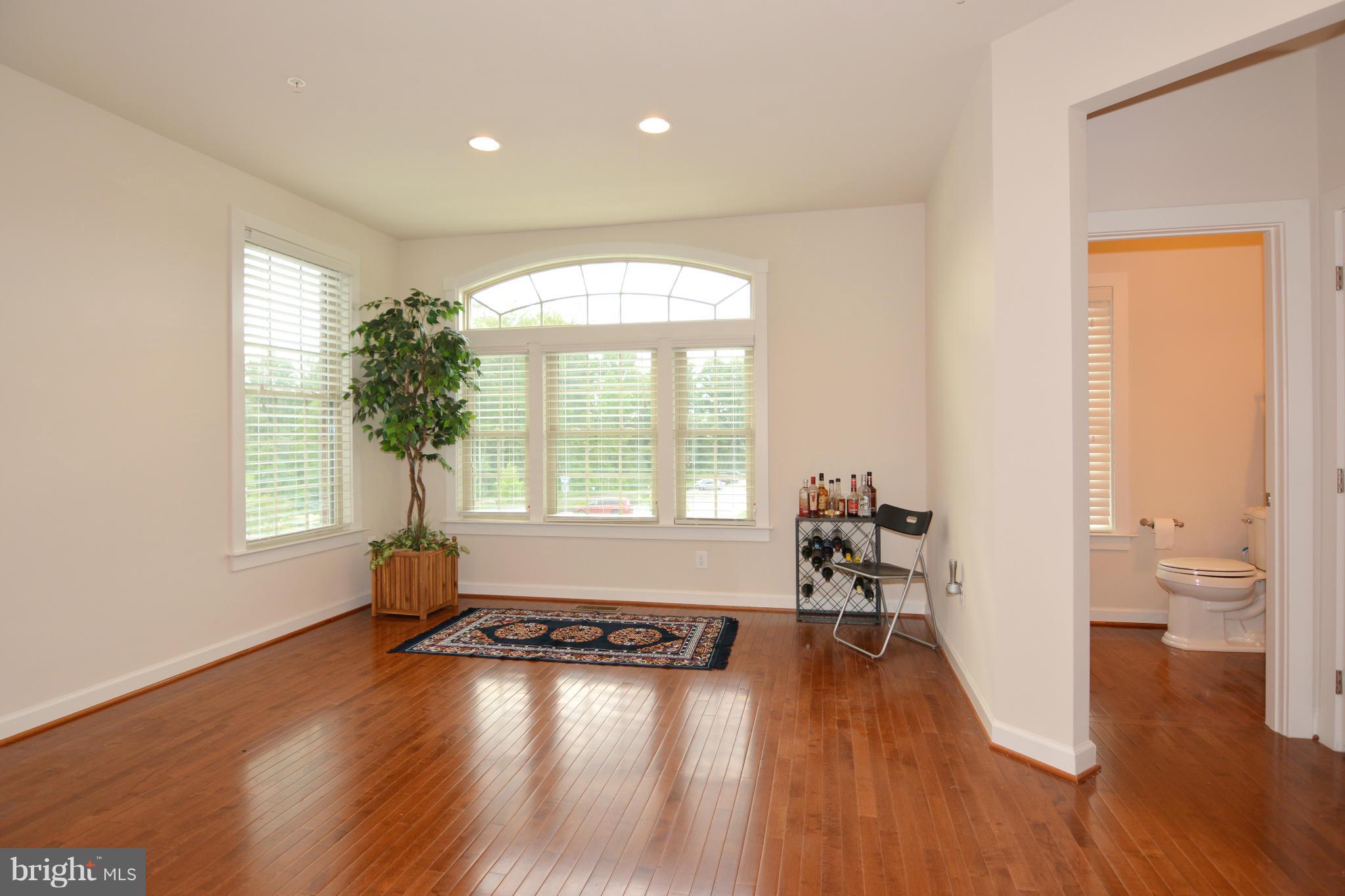 7403 Matapan Drive Hanover, MD 21076 - Photo 5 of 37 Hardwood floors in the entire great room