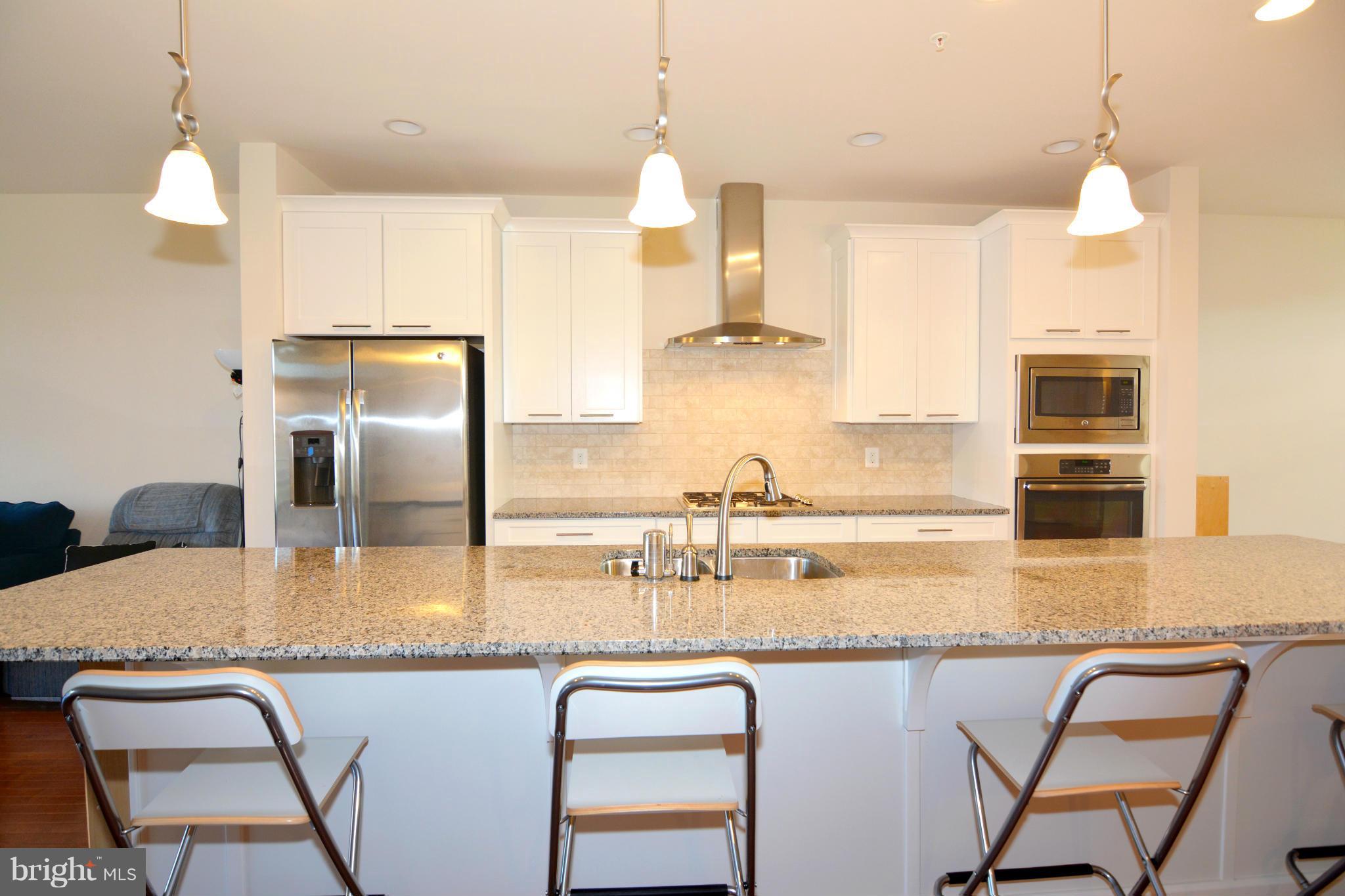 7403 Matapan Drive Hanover, MD 21076 - Photo 8 of 37 Gathering spaces for all your guests