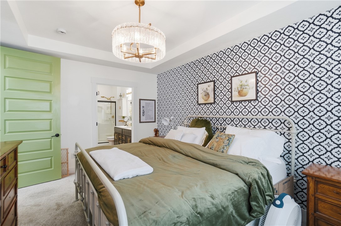 605 Cape Cod Court Beavercreek, OH 45430 - Photo 25 of 54 This tranquil bedroom features a decorative wall and an ensuite bathroom for ultimate comfort.