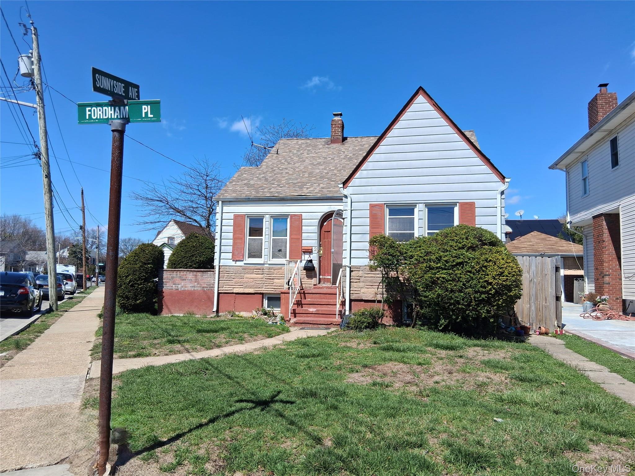 2 Fordham Place Hempstead, NY 11550 - Photo 1 of 7 a front view of a house with garden