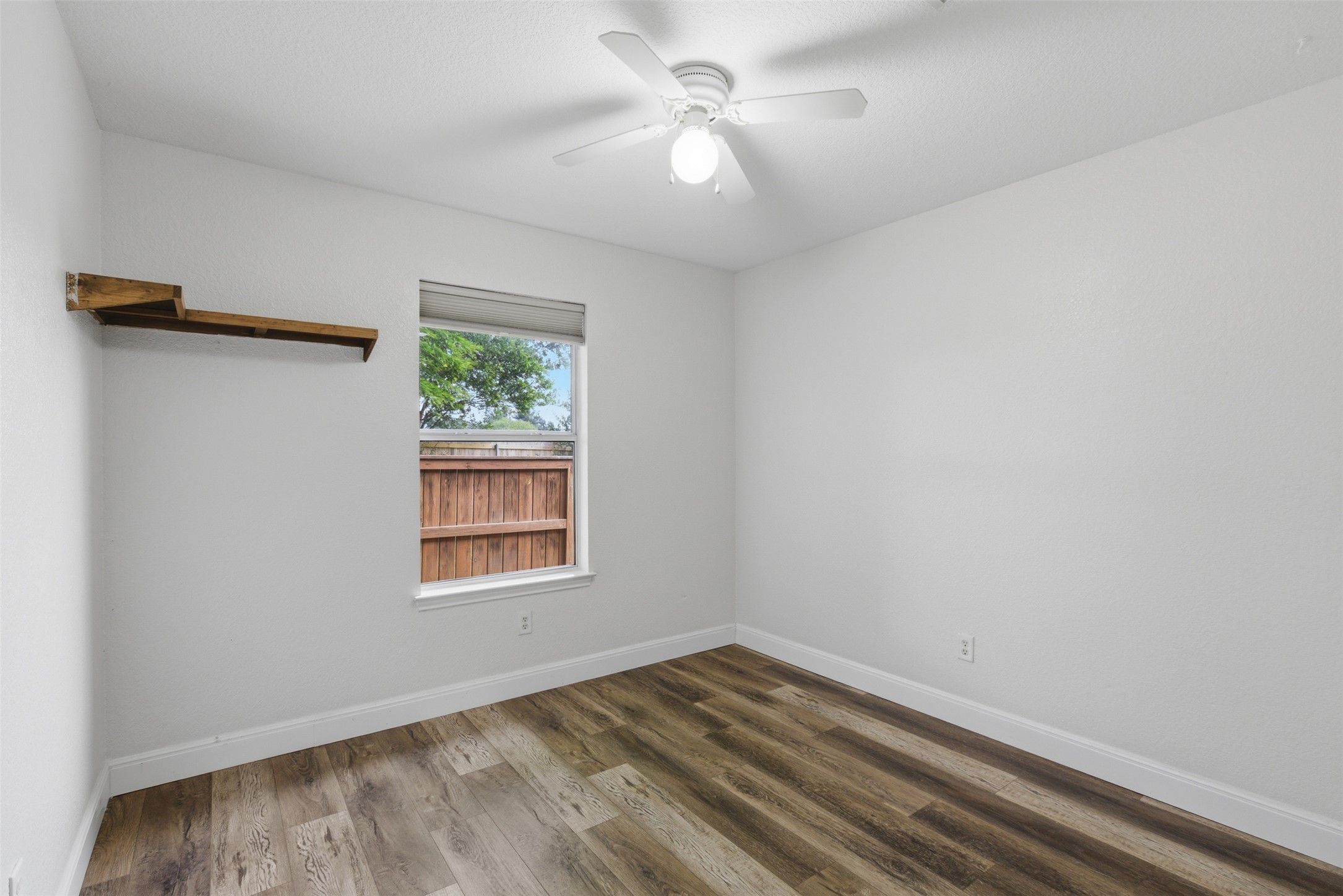 112 Prairie Springs Loop Georgetown, TX 78626 - Photo 14 of 23 an empty room with a window and a ceiling fan